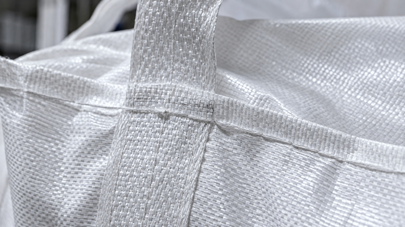 Close-up of woven polypropylene FIBC fabric, stitching and reinforced seam construction